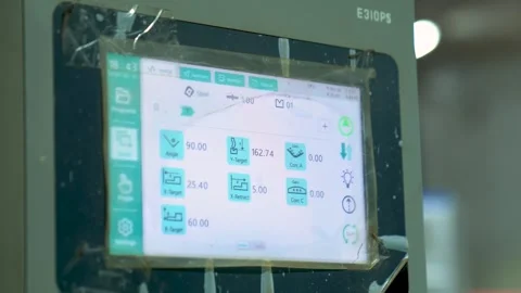 Close Up Shot Of A Machinist Programming A CNC Machine Interface On A Digital Stock Footage 332902853