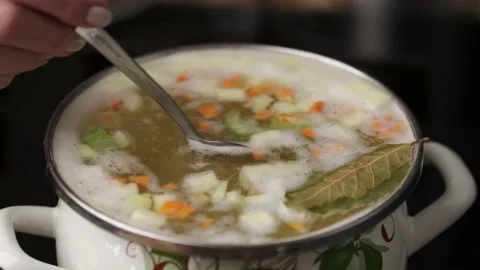 Close up shot of making soup in the sauce pan Stock Footage 238904707