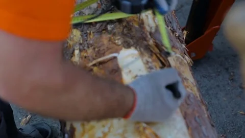 Close up shot of a male carpenter using a measuring tape and a pencil to mark a Stock Footage 73729333
