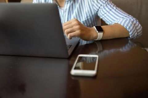 Close-up shot of male code developer hands typing, working behind office table Stock Photos