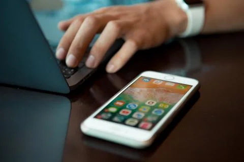 Close-up shot of male code developer hands typing, working behind office table Stock Photos