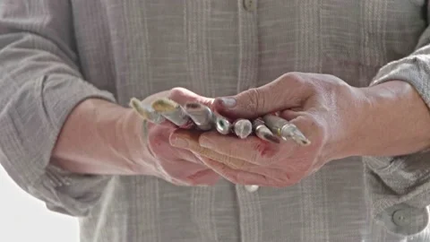Close-up shot of male painters hands holding paintbrushes to camera Stock Footage