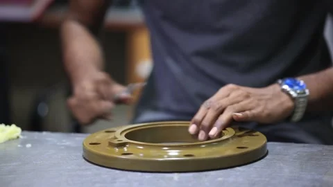 Close up shot man applying grace on the casting part in factory. Stock Footage 297743794