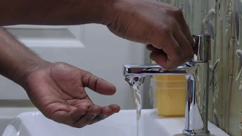 Close shot of a man cleaning hands in the wash basin Stock Footage 147293326