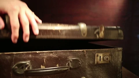 Close up shot of a man closing old suitcase. Stock Footage