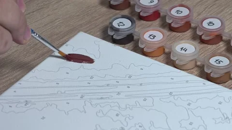 Close-up Shot of Man Doing a Paint-by-Numbers Art Hobby Video stock 317704466