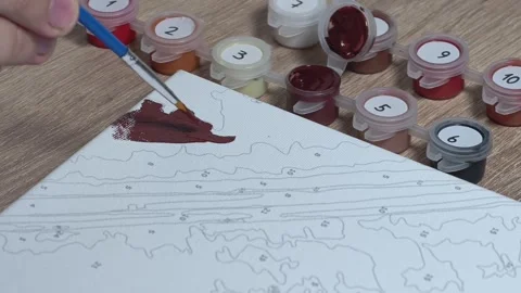 Close-up Shot of Man Doing a Paint-by-Numbers Art Hobby Video stock 317704468