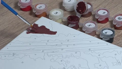 Close-up Shot of Man Doing a Paint-by-Numbers Art Hobby Video stock 317704469