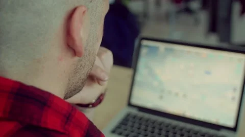Close up shot of man drinks coffee while working in the startup office Stock Footage 62948672