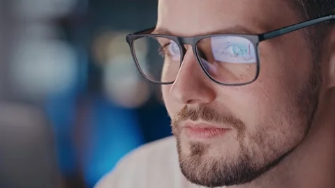Close up shot of man eyeglasses reflection graphic analysis. Businessman Stock Footage 256143297