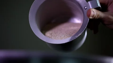 Close up shot of a man hand putting carefully a small amount of brown sugar from Stock Footage 137541692