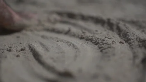 Close up shot on a man hand touching the sand beach. Slow motion real life Stock Footage 100164126