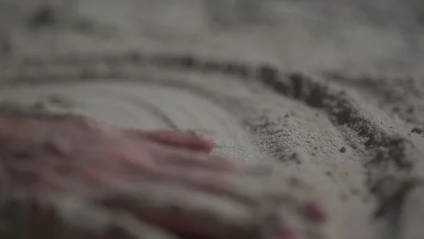 Close up shot on a man hand touching the sand beach. Slow motion real life Stock Footage 100165035