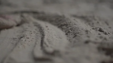 Close up shot on a man hand touching the sand beach. Slow motion real life Stock Footage 100165051