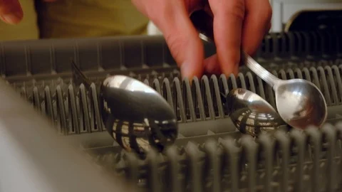 Close up shot of man hands loading dishes into dishwasher Video stock 128159278