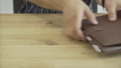 Close up shot of man hands opening elegant light brown leather daily planner jou Video stock 137539089