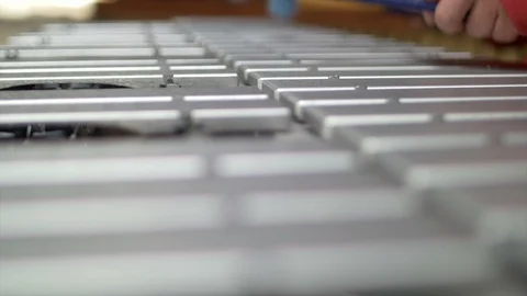 Close up shot of Man hands playing the vibraphone in red outfit. nice bokeh back Stock Footage 104500385