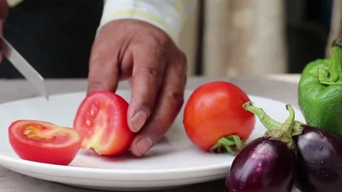 Close up shot of man hands slicing   tomato Stock Footage 154162109
