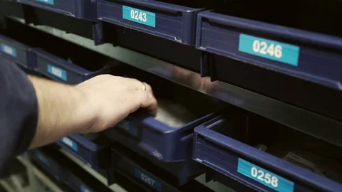 Close up shot of man hands taking bag from shelf in warehouse Stock Footage 75317988