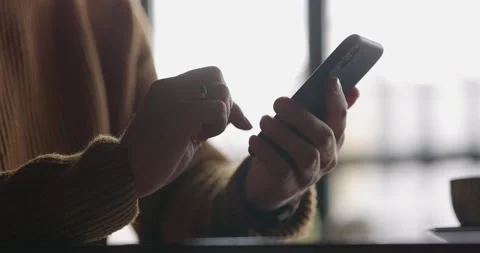 Close up shot of man hands with watch using mobile phone while working at laptop Stock Footage 165248286