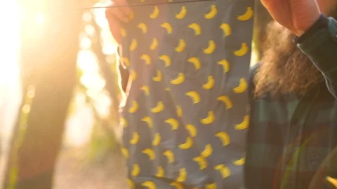 Close-up shot of man hanging clothes while camping during winter, Croatia. Stock Footage 127219314