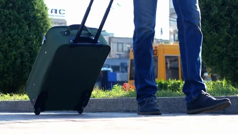Close up shot of man legs with the baggage suitcase  walking to the airport. Stock Footage 111644224