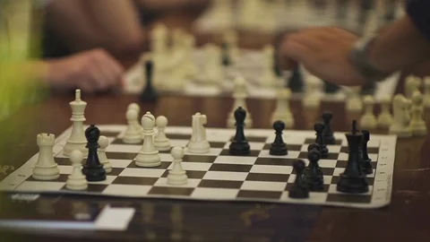 Close up shot of a man making a move on a chessboard during the competition Stock Footage 119898271