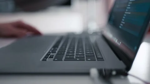 Close up shot of a man opening a notebook computer and typing. Shallow Stock Footage 149992779