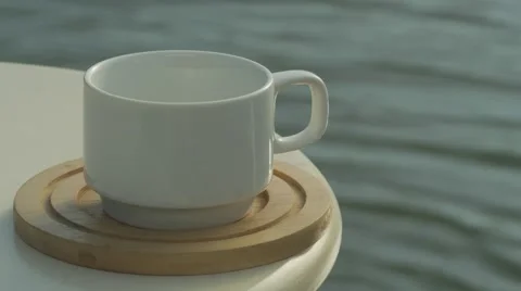 Close shot of a man picking up a cup of coffee Video stock 58994659