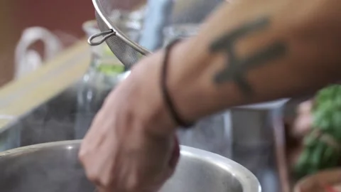 Close up Shot of Man Picking up Fish With Tong In slow Motion  Stock Footage 146250237