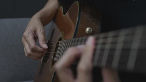 Close-up shot of a man playing a classical guitar. Stock Footage 127330883