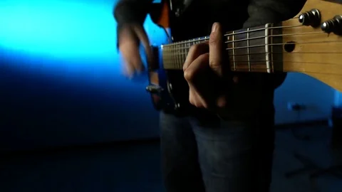 This is a close up shot of a man playing a guitar Stock Footage 71083700