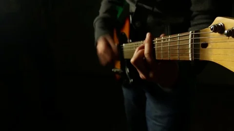 This is a close up shot of a man playing a guitar Stock Footage 71083890