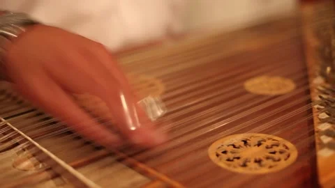 Close up shot  of a man playing zither Stock Footage 208679541