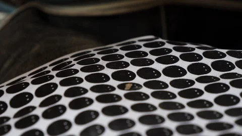 Close up shot of man preparing paper circle templates for wood cutting, Bali Stock Footage 140250327