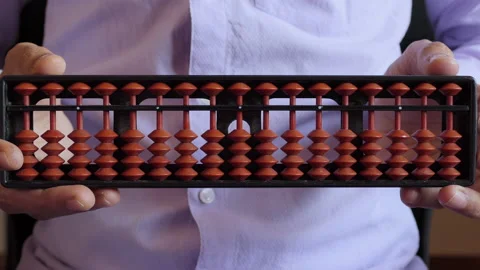 Close shot of a man showing abacus towards the camera Stock Footage 148568432