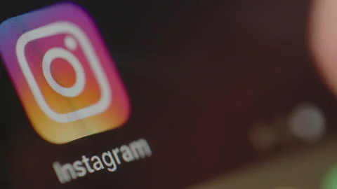 Close shot of Man starts using Instagram on a smartphone Stock Footage 134375452