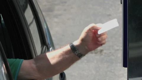 Close up shot of a man taking a parking lot ticket at an automated pay machin Video stock 140942398