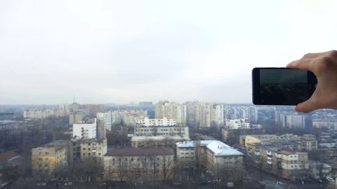 Close-up shot of man texting on smart phone against cityscape Video stock 83531431