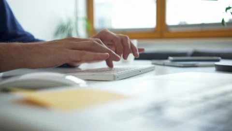 Close-up shot of man typing on keyboard working at office Stock Footage 162468547