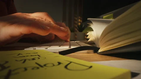 A close-up shot of a man typing on a keyboard and pressing enter. disinformation Stock Footage 172419673