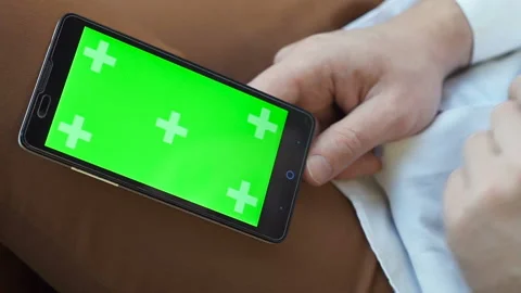 Close up shot of a man using smartphone with chroma key green screen Stock Footage 154850740