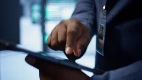 Close up shot of man using tablet in data center, ensuring rigs are functioning 動画素材 277646880