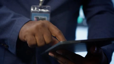 Close up shot of man using tablet in data center, ensuring rigs are functioning Stock Footage 277653803