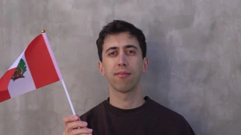 Close up shot of a man waving Peruvian flag in slow motion. Peru country flag. Video stock 337891082