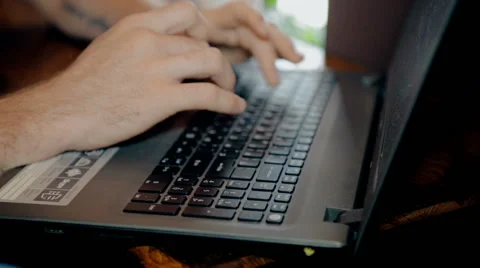 Close up shot Man working on computer and drink coffee in cafe Stock Footage 65716929