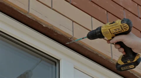 Close up shot Man working with electric drill and screwdrive Stock Footage 65291265