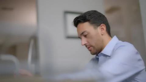 Close up shot of man working from home entering from his kitchen Stock Footage 145725333