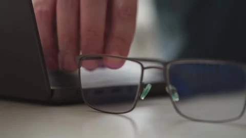 A close-up shot of a man working on a laptop. Stock Footage 348240937