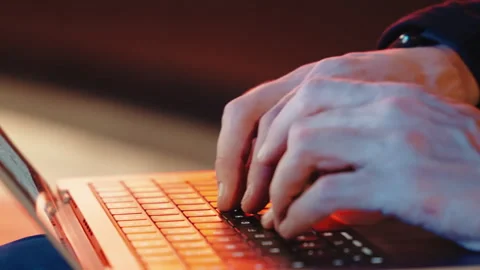 Close-up shot of a mans actively typing on expensive laptop and moving hands Stock Footage 321467596
